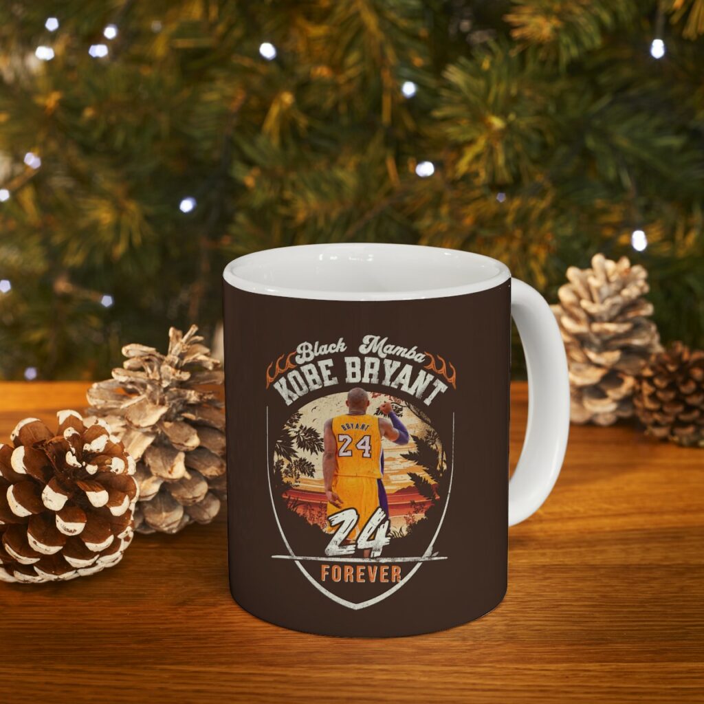 Celebrate the remarkable life and legacy of Kobe Bryant with our "In Loving Memory of Kobe Bryant 24 Forever" Ceramic Mug. This beautifully crafted mug features a dual side image, capturing the essence of one of basketball's greatest icons. Perfect for fans and collectors alike, this mug serves as a daily reminder of Kobe's passion, dedication, and unforgettable impact on the game.